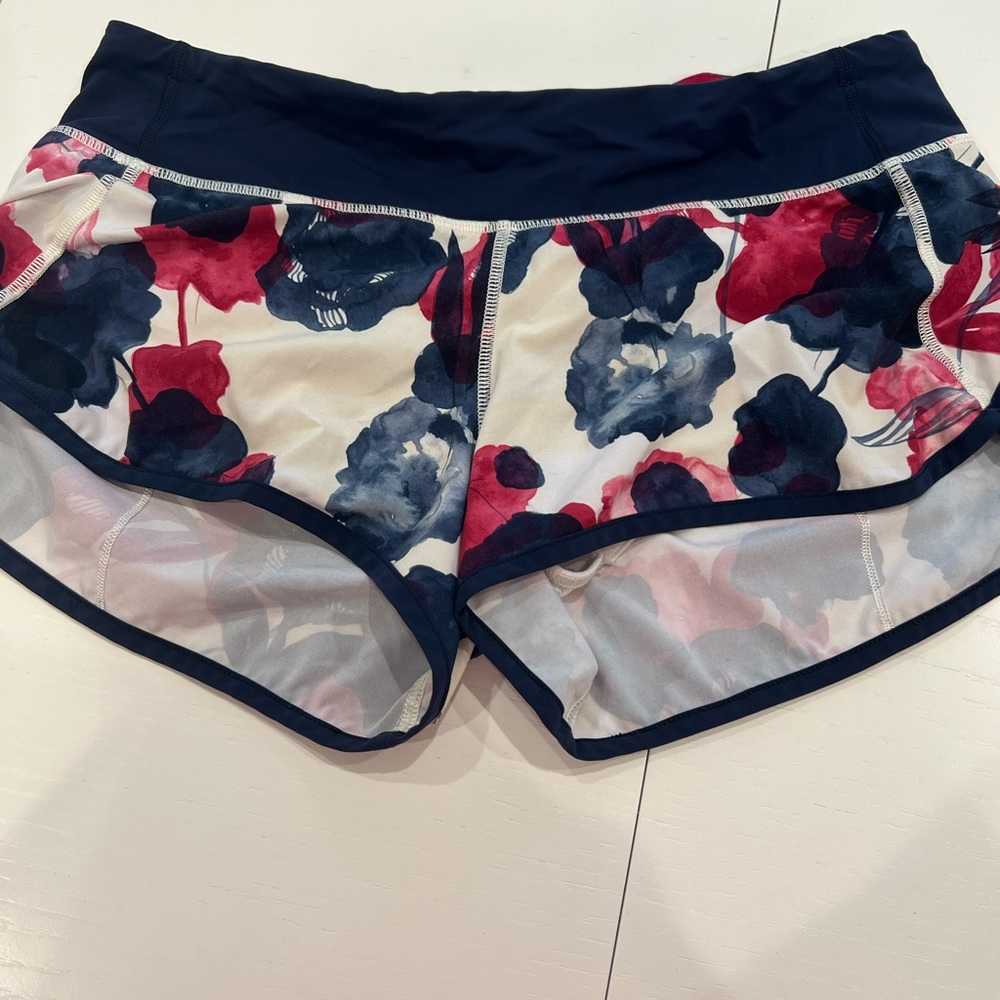 Lululemon floral colored speed ups size 8 small rips in the liner